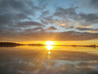 Spectacular sunset over  frozen lake in the Sweden in winter