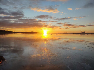 Spectacular sunset over  frozen lake in the Sweden in winter