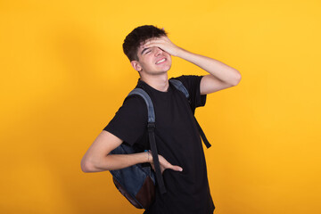 isolated student with backpack with back pain