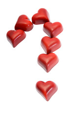 Fototapeta premium Chocolate Hearts Making Question Mark on White