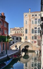 a canal of Venice on a sunny day