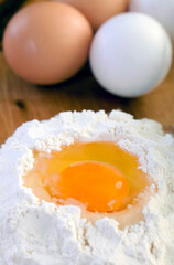 Egg in Flour with Eggs on Wooden Table