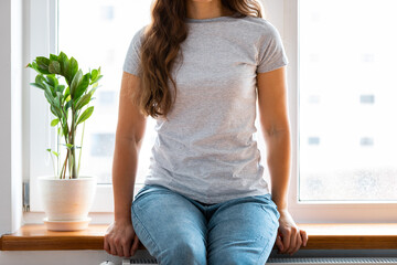 Woman wearing white blank t-shirt with space for your logo