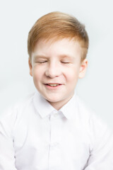 Emotional portrait of boy with closed eyes