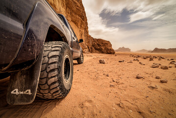 offroad car tire on the sand in desert