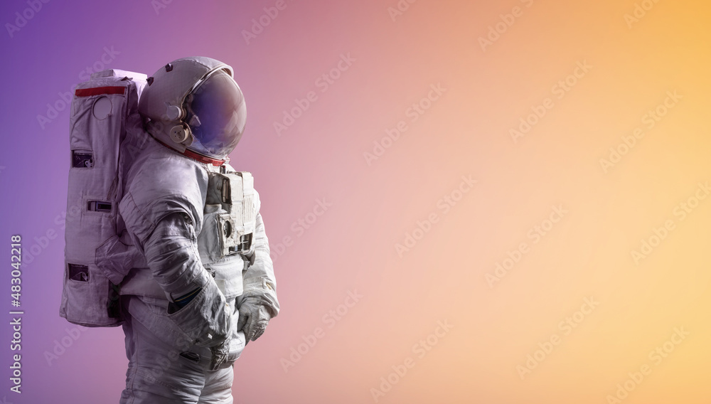 Poster Astronaut stay on isolated background with gradient color. Spaceman alone. Creative sci-fi space wallpaper with light. Elements of this image furnished by NASA