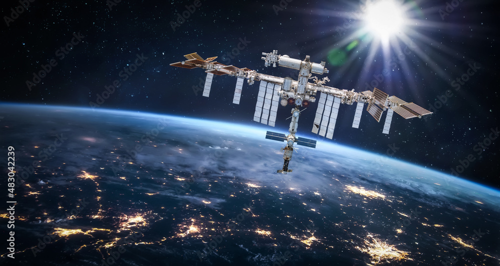 Leinwandbilder International space station in 2022 in outer space with Earth at night. ISS floating on orbit of nightly Earth planet. Elements of this image furnished by NASA