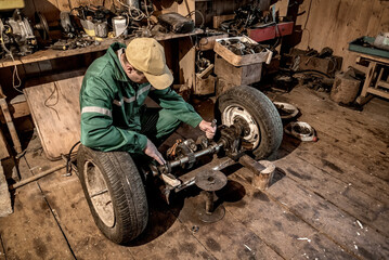 Fototapeta na wymiar wheel on the floor with workshop tools