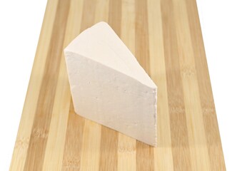 Slice of sardinian salted sheep ricotta on a two-tone cutting board. White background.