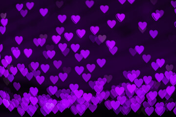 Obraz premium Bokeh background with purple hearts on black background. Love concept. Theme for Valentine's Day
