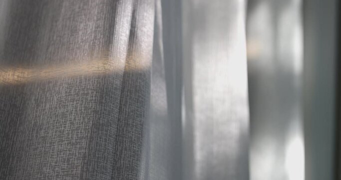 4K video slow motion of curtain in the wind. Concept for cozy and modern residential house.