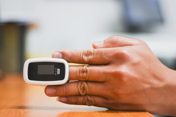 A Fingertip oximeter is used to measure the patient.