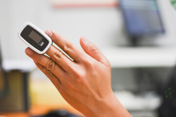 A Fingertip oximeter is used to measure the patient.