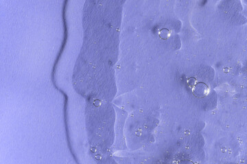 Textured backdrop with air bubbles. Gel, serum or hyaluronic acid on violet blue background....