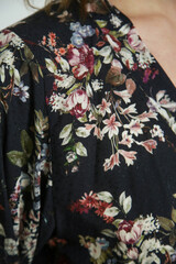 Close up of dark floral viscose fabric