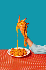 Food pop art photography. Female hands tasting spaghetti with meatballs on plaid tablecloth isolated on bright blue background. Vintage, retro style interior