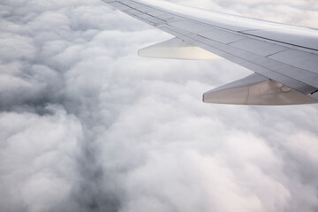 Morning sunrise with Wing of an airplane flying above the ocean. The view from an airplane window. Photo applied to tourism operators. picture for add text message or frame website.