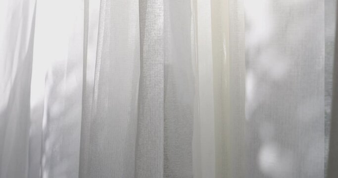 4K video slow motion of curtain in the wind. Concept for cozy and modern residential house.