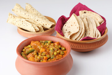 Indian food, Roti or Indian flat bread, mix vegetable masala, pappad and raitha