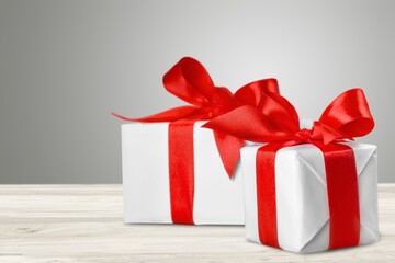 Beautiful gift box with red ribbon bow