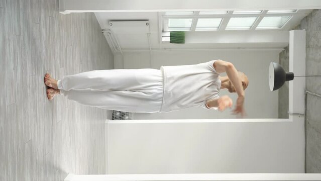 Young choreographer demonstrates elements of modern dance on camera.