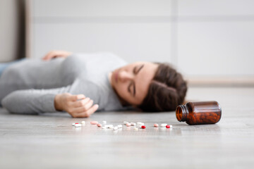 Female with pile of antidepressants kill herself, commit suicide, suffer from mental distress
