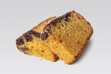 Two pieces of breakfast cake on a light background