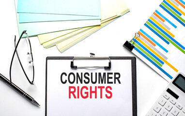 CONSUMER RIGHTS text on paper sheet with chart,color paper and calculator