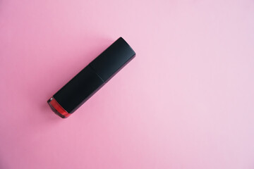close up of lipstick on pink gradient background. cosmetic products, make up accessory, beauty lifestyle