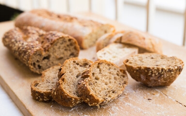 fresh loaf of bread on wooden board