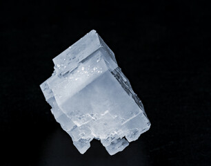 Crystals of potassium chloride on a black background