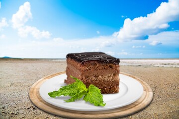 2022 Happy New Year concept with chocolate cake and on the beach