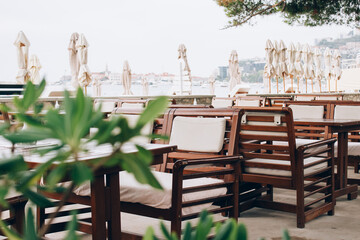 Empty summer beach cafe or restaurant, openair restaurant interior as background