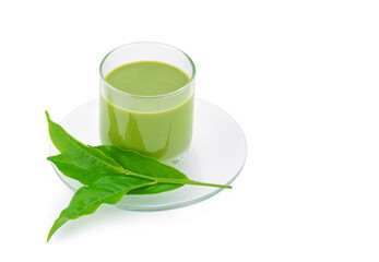 Hot green tea matcha latte and tea leaves isolated on white background.