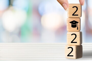 2022 Education New year. holding wooden block.
