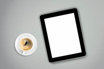 tablet computer with a cup of tea or coffee. concept business or to do list goals