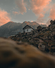 White house near mountain under cloudy sky