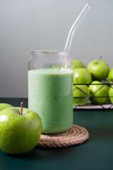 Blended apple smoothie with ingredients selective focus