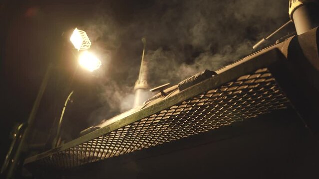 Hot BBQ Charcoal Grill Splashing Fire at Night