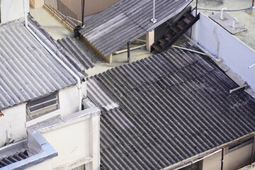 Dangerous asbestos, eternit as building material for roof and wall cladding. In many countries, this material is banned due to the cancer risk posed by microfibers. Roof covering favela Rio de Janeiro