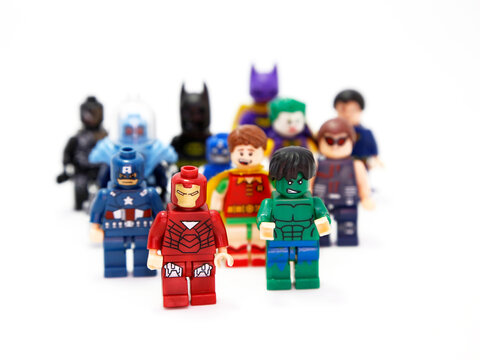 Lego Marvel. Superheroes and villains. Hulk, Ironman, Robin, Batman, Captain America, Joker, Catwoman, Superman, Venom. Toys for childrens. Small plastic figures. Fight of good against evil. Isolated.