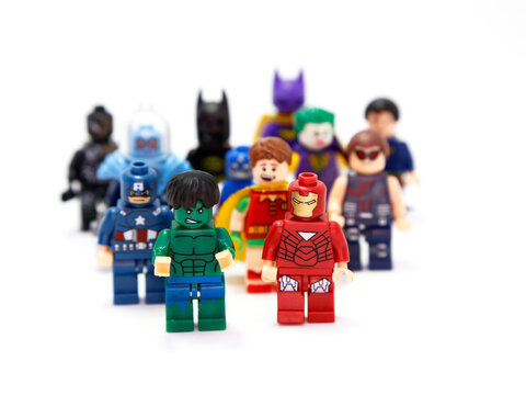 Lego Marvel. Superheroes and villains. Hulk, Ironman, Robin, Batman, Captain America, Joker, Catwoman, Superman, Venom. Toys for childrens. Small plastic figures. Fight of good against evil. Isolated.