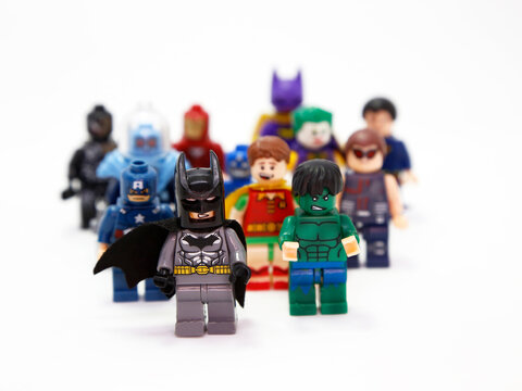 Lego Marvel. Superheroes and villains. Batman, Captain America, Hulk, Robin, Joker, Ironman, Catwoman, Superman, Venom. Toys for childrens. Small plastic figures. Fight of good against evil. Isolated.