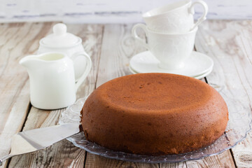 Chocolate-cottage cheese cake on wooden background.