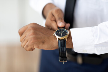 African American businessman wearing expensive wrist watch - obrazy, fototapety, plakaty
