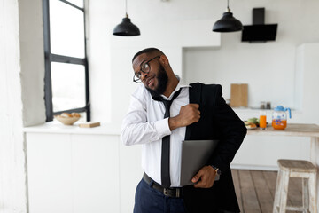 African American man talking on mobile phone in a hurry