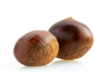Fototapeta premium Autumn delicacies, chestnuts, white, white background