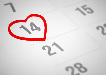 White paper planner calendar with red heart shape mark on 14 February, 