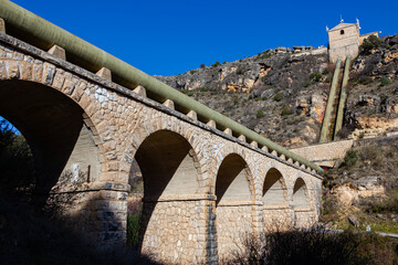 Obraz premium Stone-paved streets and terraced houses. Wrought iron decoration in the houses of the town of Patones in Madrid.