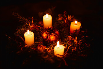 Christmas decor setup with the 4 Advent candles lit on. Winter holiday decorations